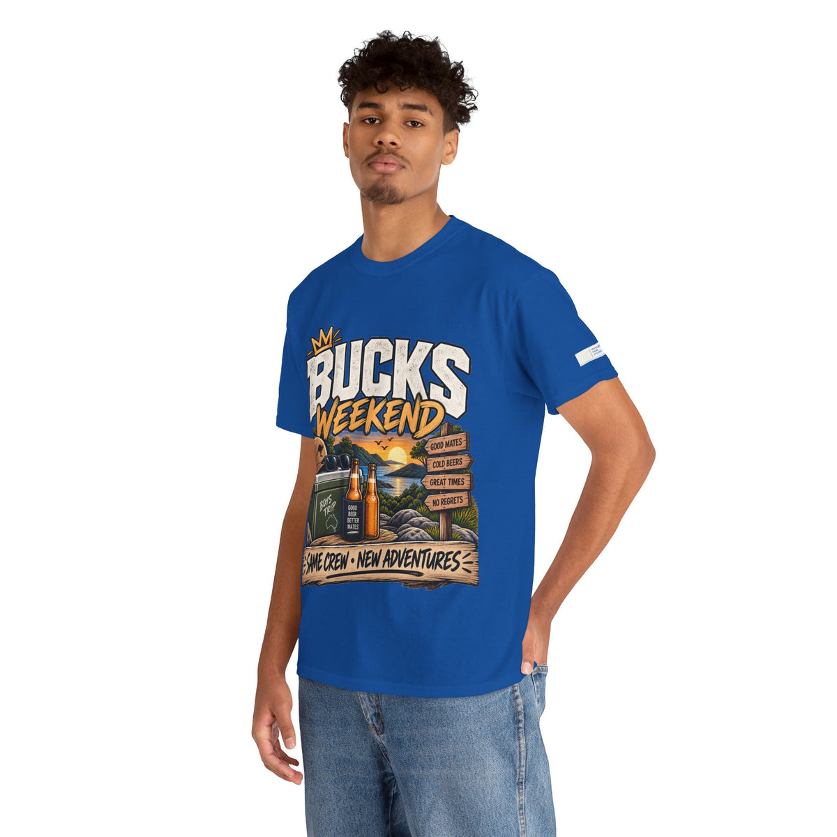 A man wearing a royal blue graphic t-shirt with 'BUCKS WEEKEND' printed on the front, paired with blue jeans, set against a plain white background.