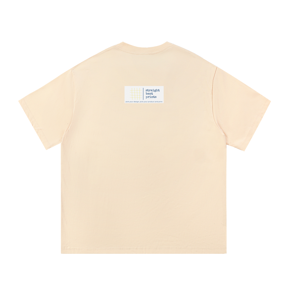 Beige t-shirt with a small label on the back against a white background