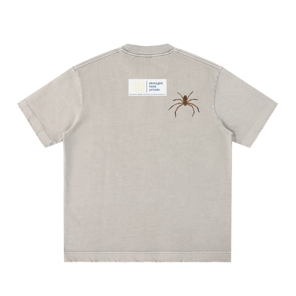 Beige t-shirt with a spider graphic on the back against a white background