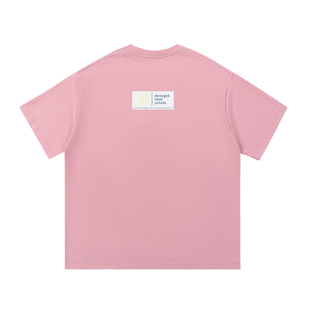 Pink t-shirt with a small label on the back against a white background