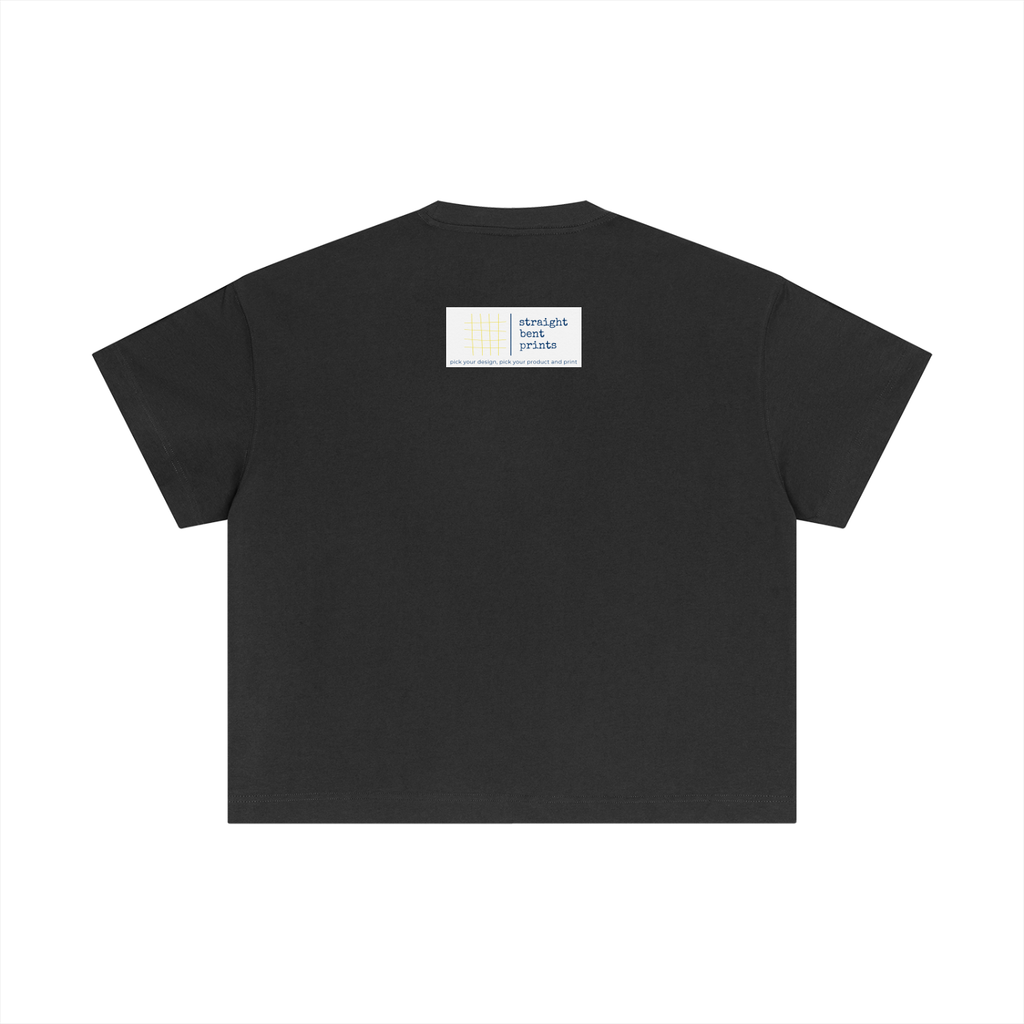 Black t-shirt with a small white label on the back against a white background