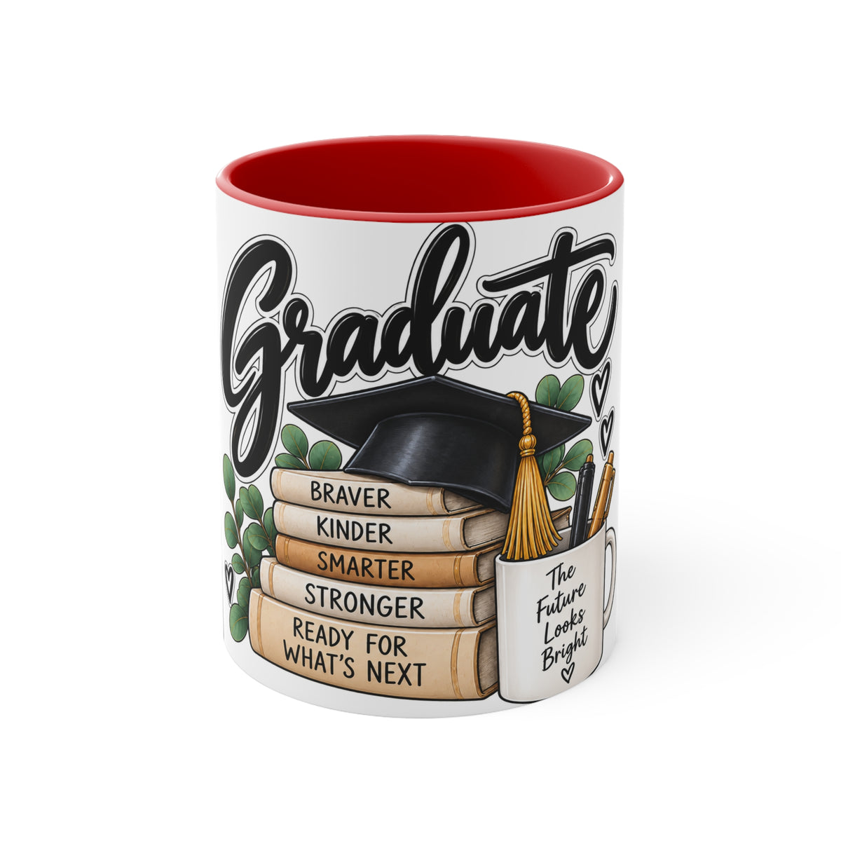 A white ceramic graduation mug with a red interior, featuring a printed design of a black graduation cap resting on stacked books with the words 'BRAVER KINDER STRONGER' and 'READY FOR WHAT'S NEXT.' The mug also includes the phrase 'The Future Looks Bright' on a small white tag graphic.