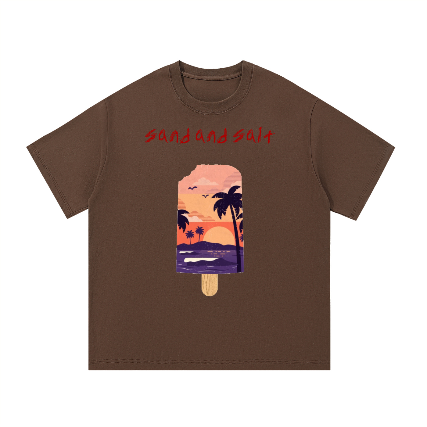 Brown t-shirt with a tropical-themed popsicle graphic and 'sand and salt' text on a white background