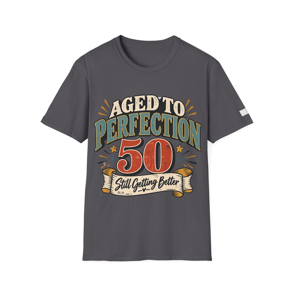A dark gray crewneck t-shirt with a retro-style graphic on the front that reads 'AGED TO PERFECTION 50 Still Getting Better' in cream, green, and red lettering, shown against a plain white background.