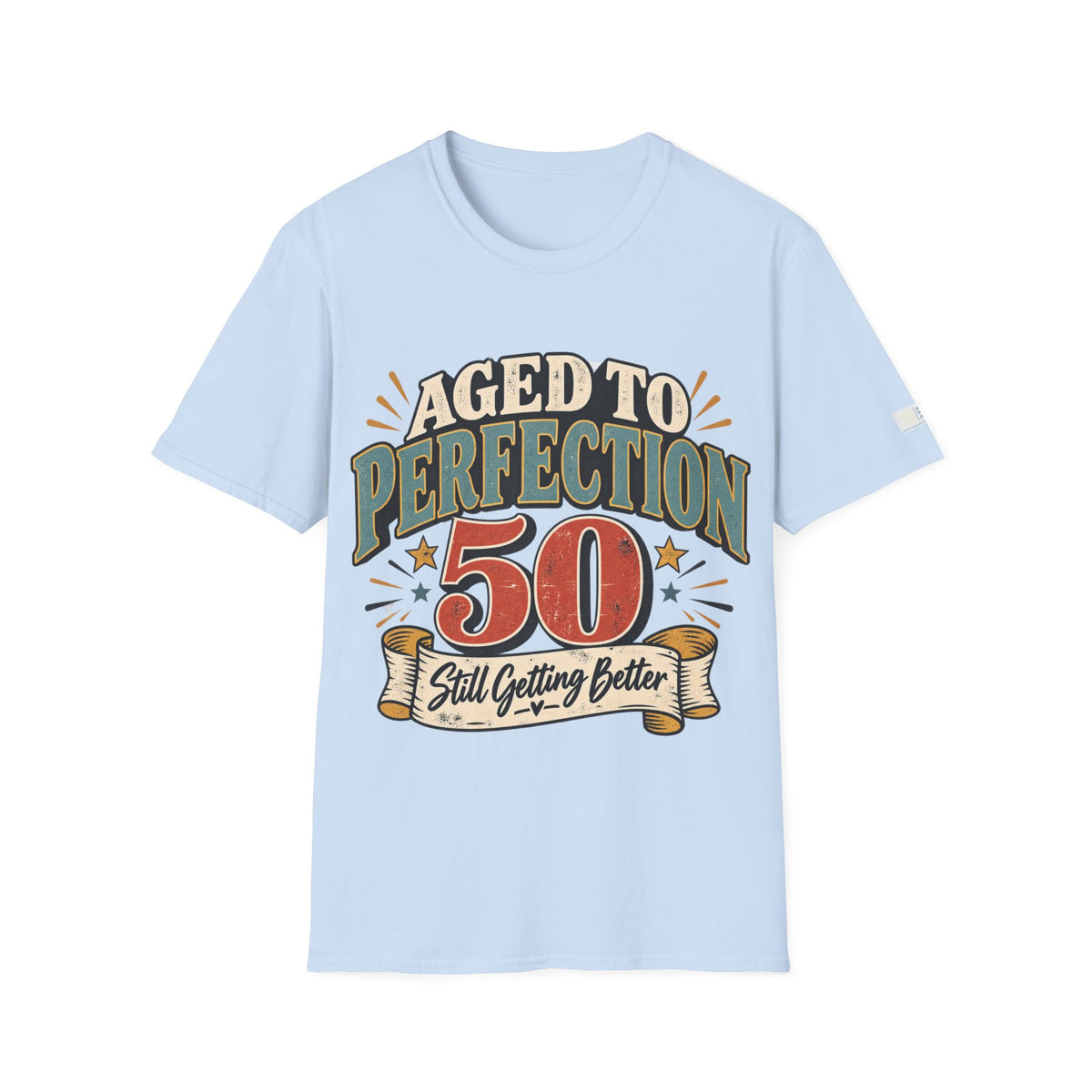 A light blue short-sleeve t-shirt with a retro-style graphic on the chest that reads 'AGED TO PERFECTION 50 Still Getting Better' in green, red, and beige tones, shown against a plain white background.