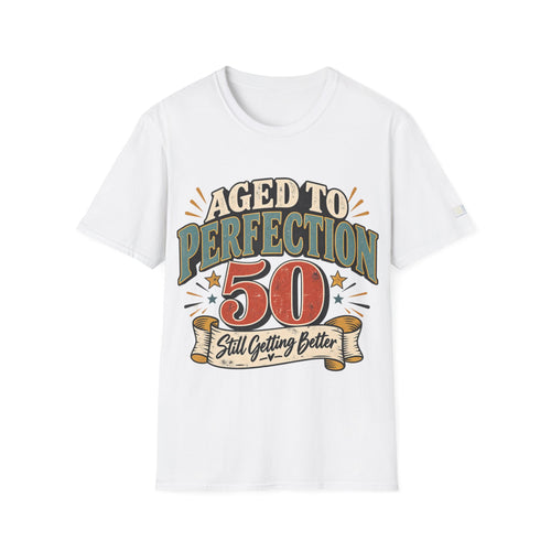 A white short-sleeve crewneck t-shirt featuring a retro-style graphic print on the front that reads 'AGED TO PERFECTION 50 Still Getting Better' in muted teal, red, and beige tones.