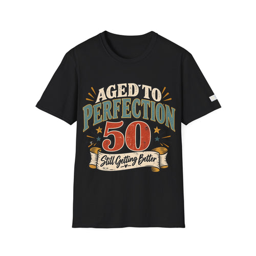 A black short-sleeve t-shirt with a vintage-style graphic on the front that reads 'AGED TO PERFECTION 50 Still Getting Better' in red, beige, and teal colors, shown against a plain white background.