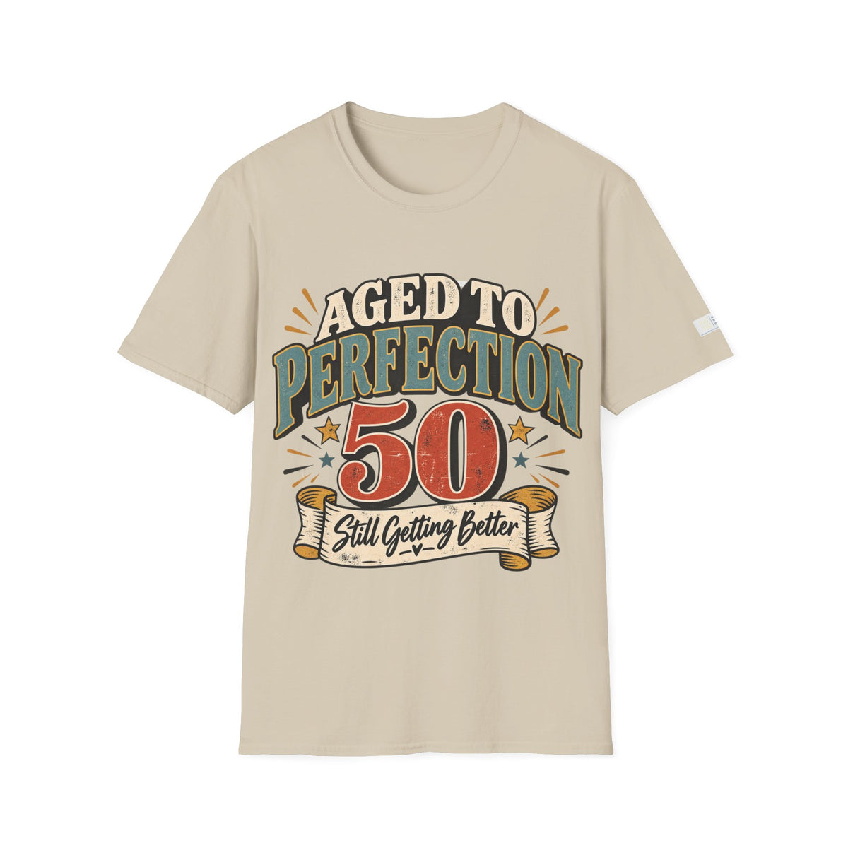 A beige short-sleeve t-shirt with a retro-style graphic on the chest that reads 'AGED TO PERFECTION 50 Still Getting Better' in teal, red, and cream lettering, displayed on a clean white background.