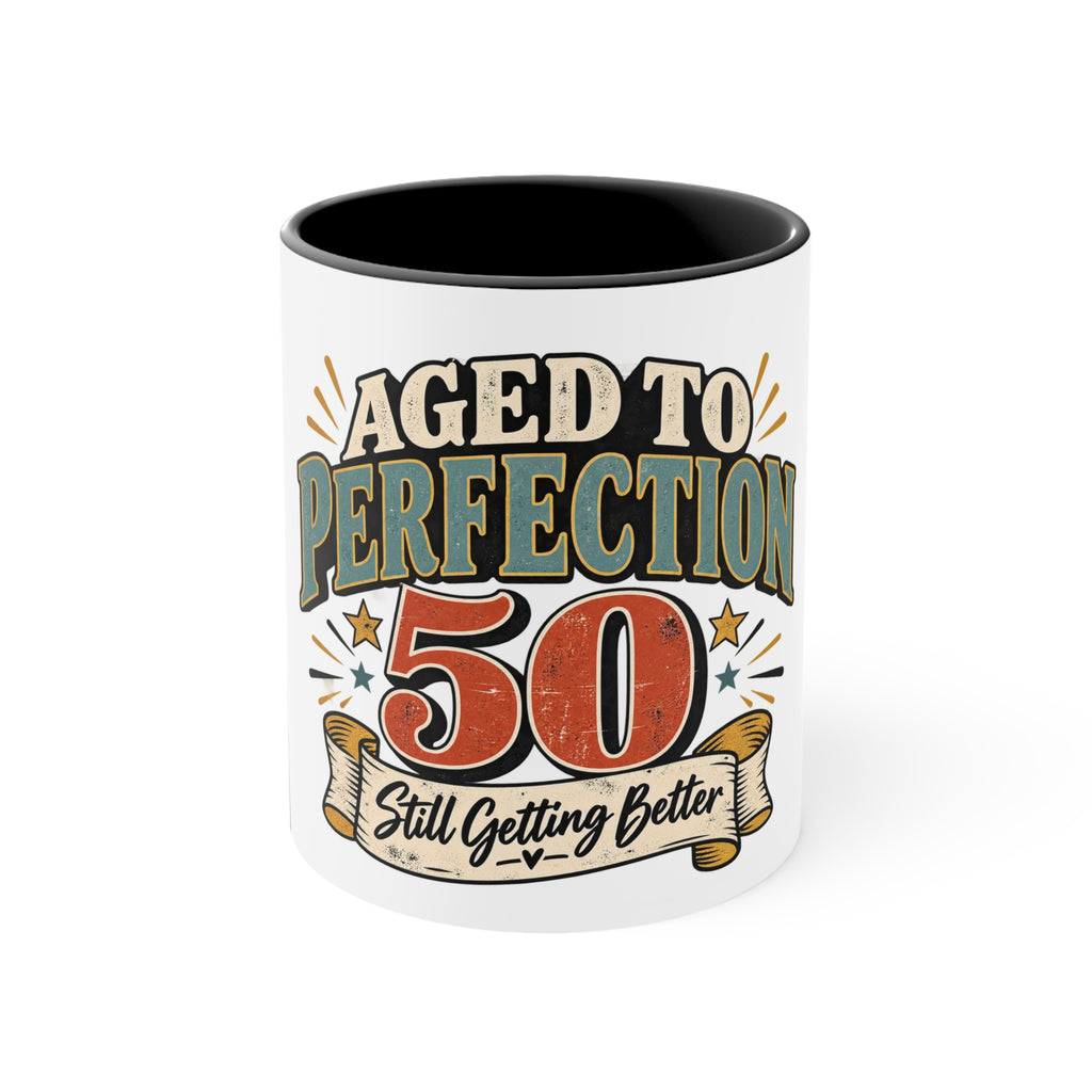 A white ceramic mug with a black interior, featuring a retro-style graphic that reads 'AGED TO PERFECTION 50 Still Getting Better' in beige, orange, and teal lettering.