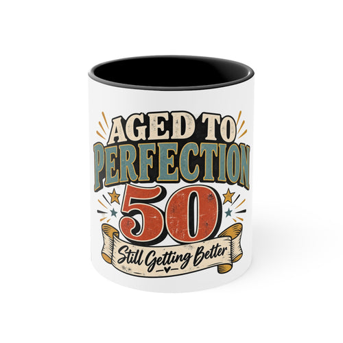 A white ceramic mug with a black interior, featuring a retro-style graphic that reads 'AGED TO PERFECTION 50 Still Getting Better' in beige, orange, and teal lettering.