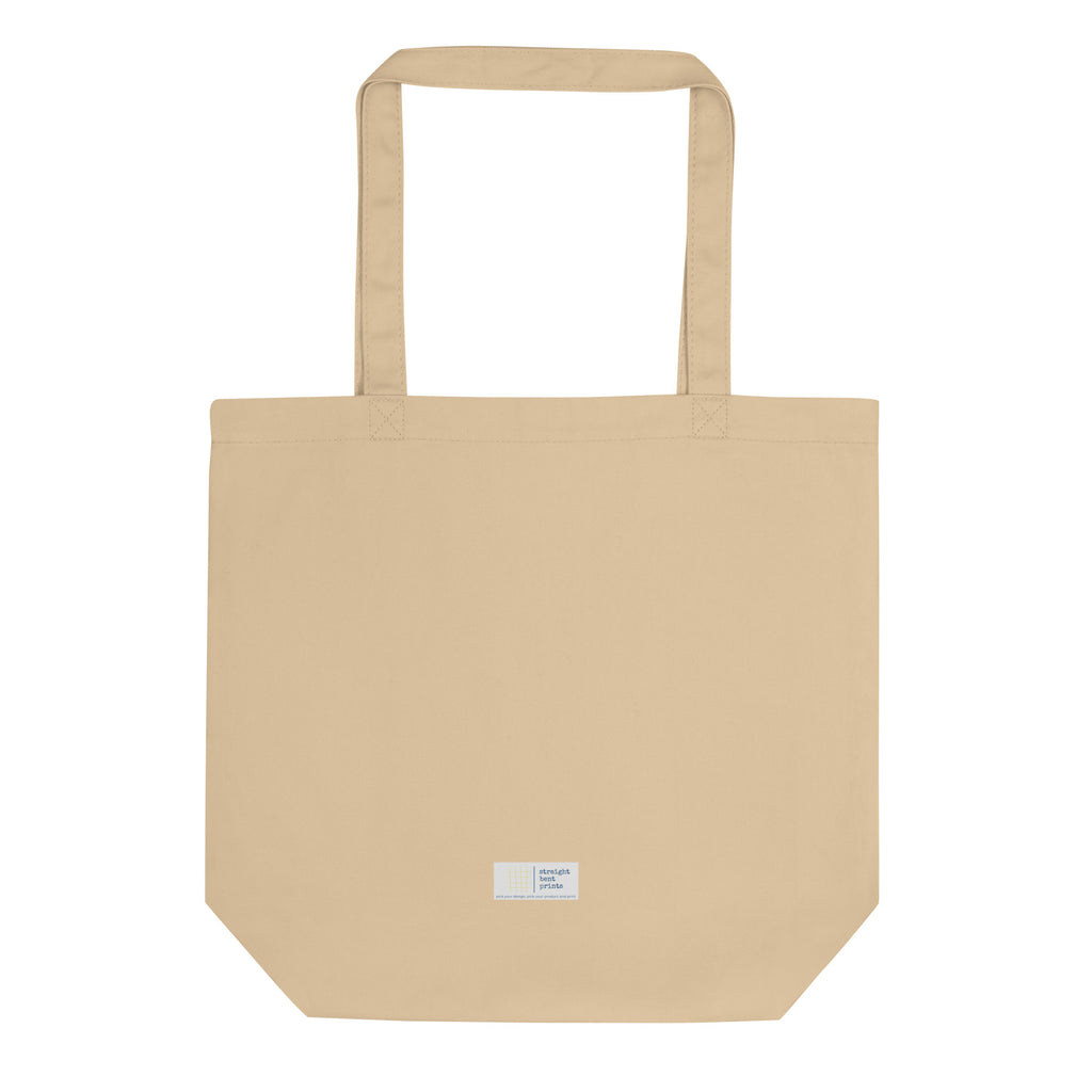Beige tote bag with a small label on a white background