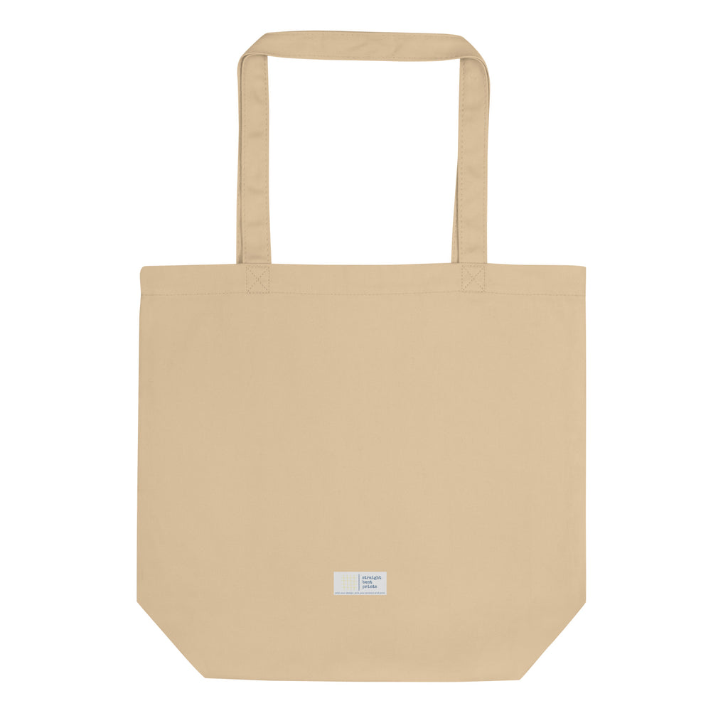 Beige tote bag with a small label on a white background