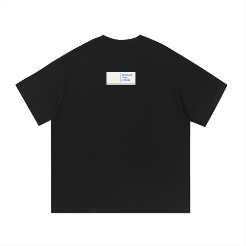 Black t-shirt with a small white label on the chest against a white background