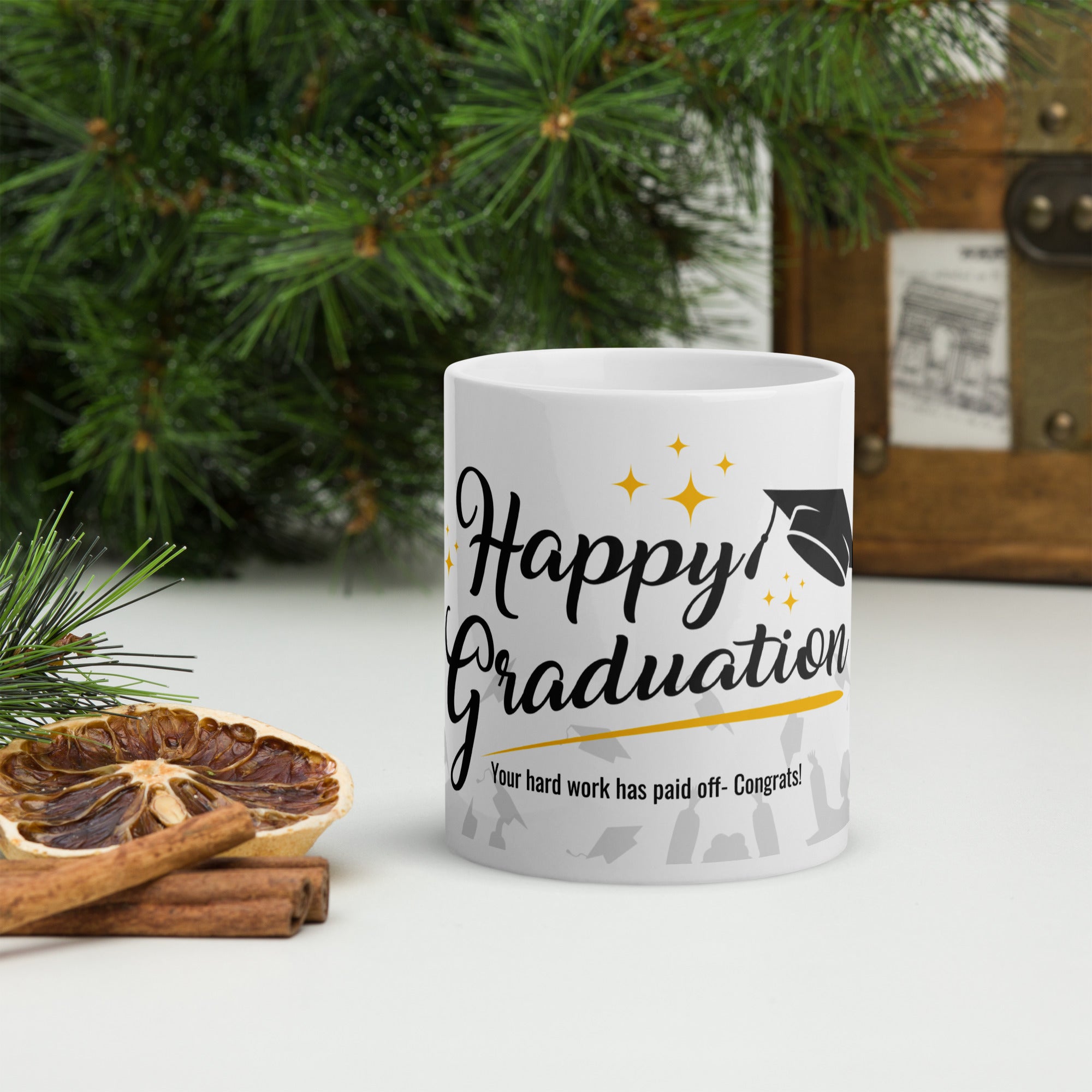 White mug with text on a surface with decorative elements