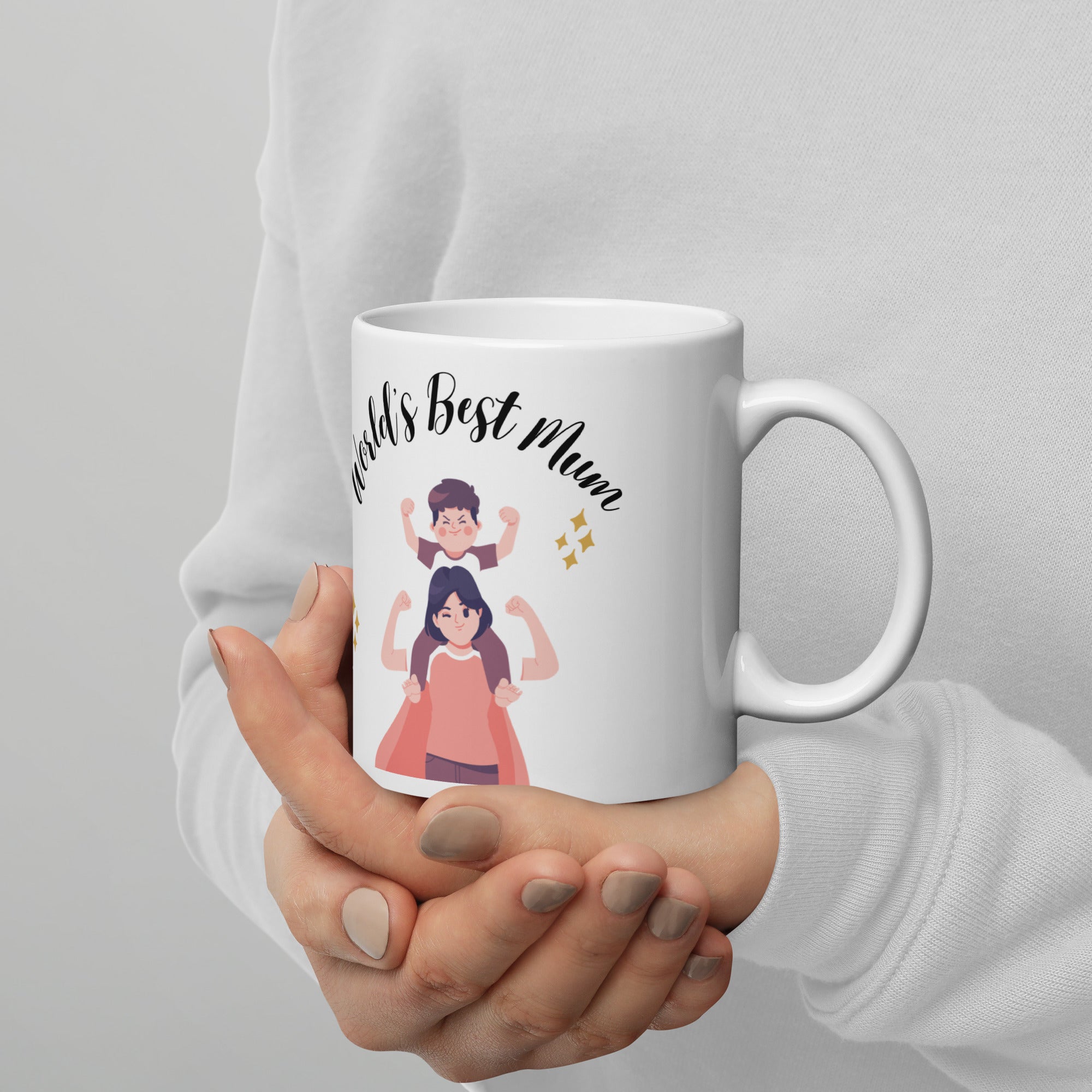 White mug with 'World's Best Mum' text and illustrations held by a person.