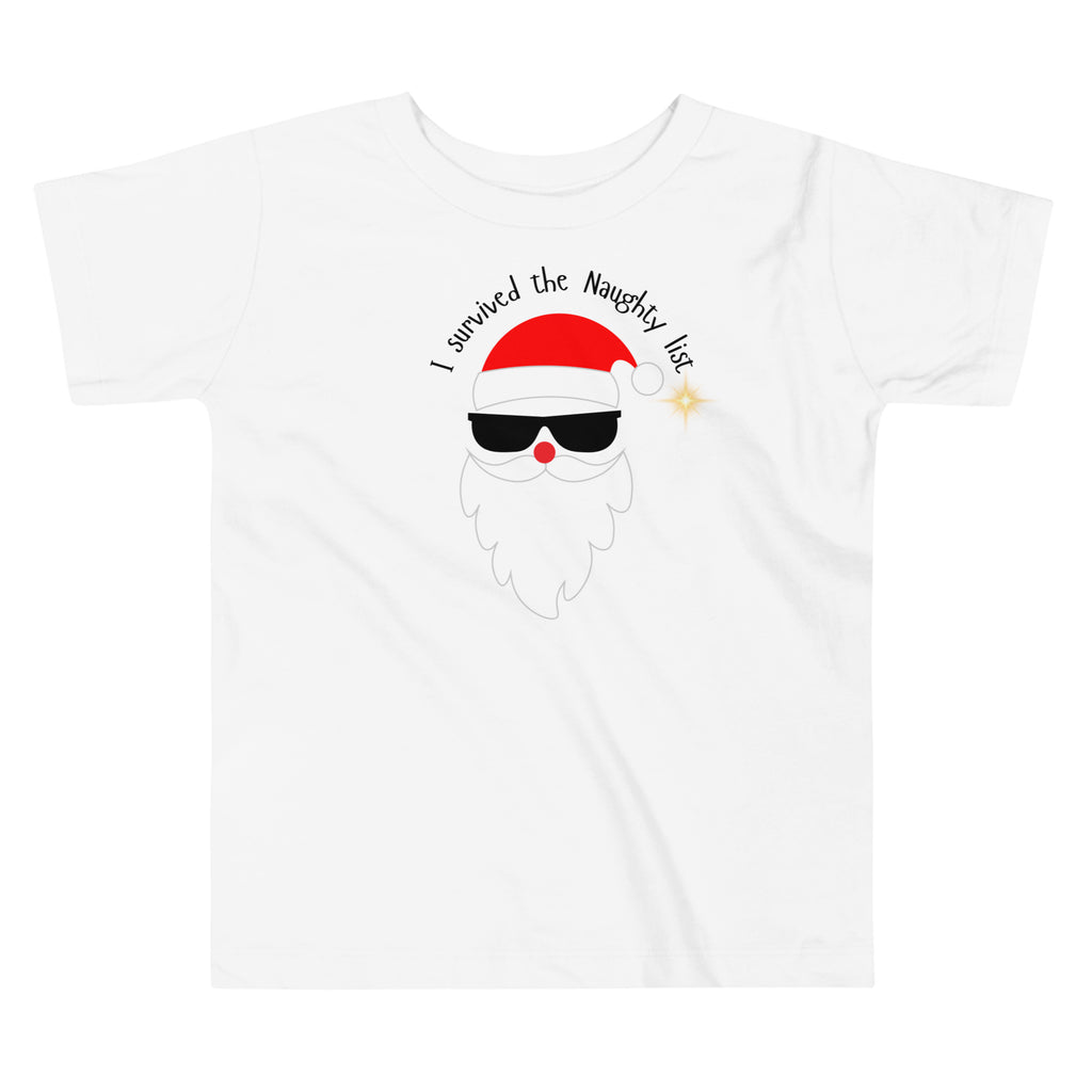 White t-shirt with a graphic of Santa Claus wearing sunglasses and a text 'I survived the Naughty list' on a white background.