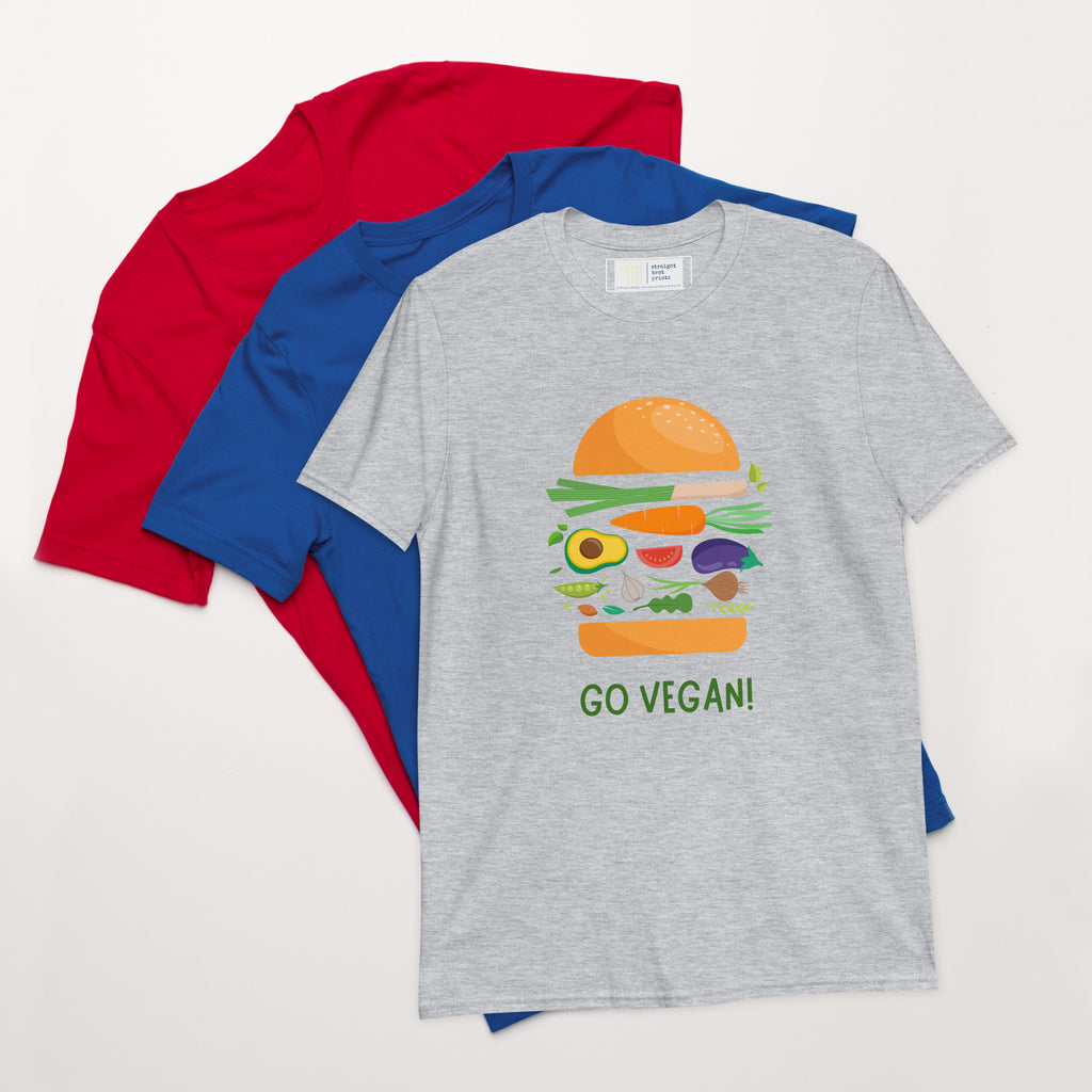 Gray t-shirt with a vegan burger graphic and 'GO VEGAN!' text, surrounded by red and blue shirts on a white background.