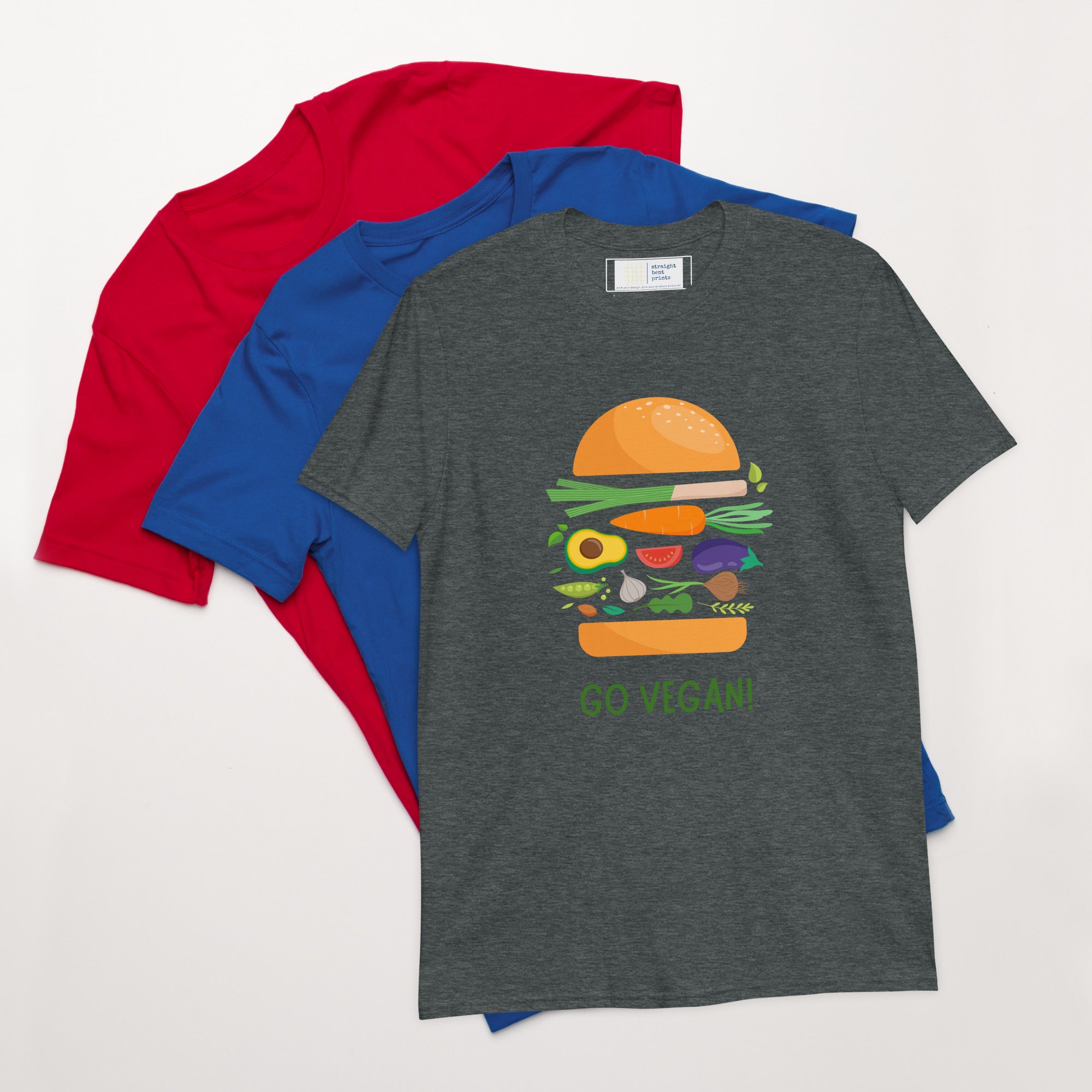 Gray t-shirt with a colorful burger graphic and 'Go Vegan' text, surrounded by red and blue shirts on a white background.