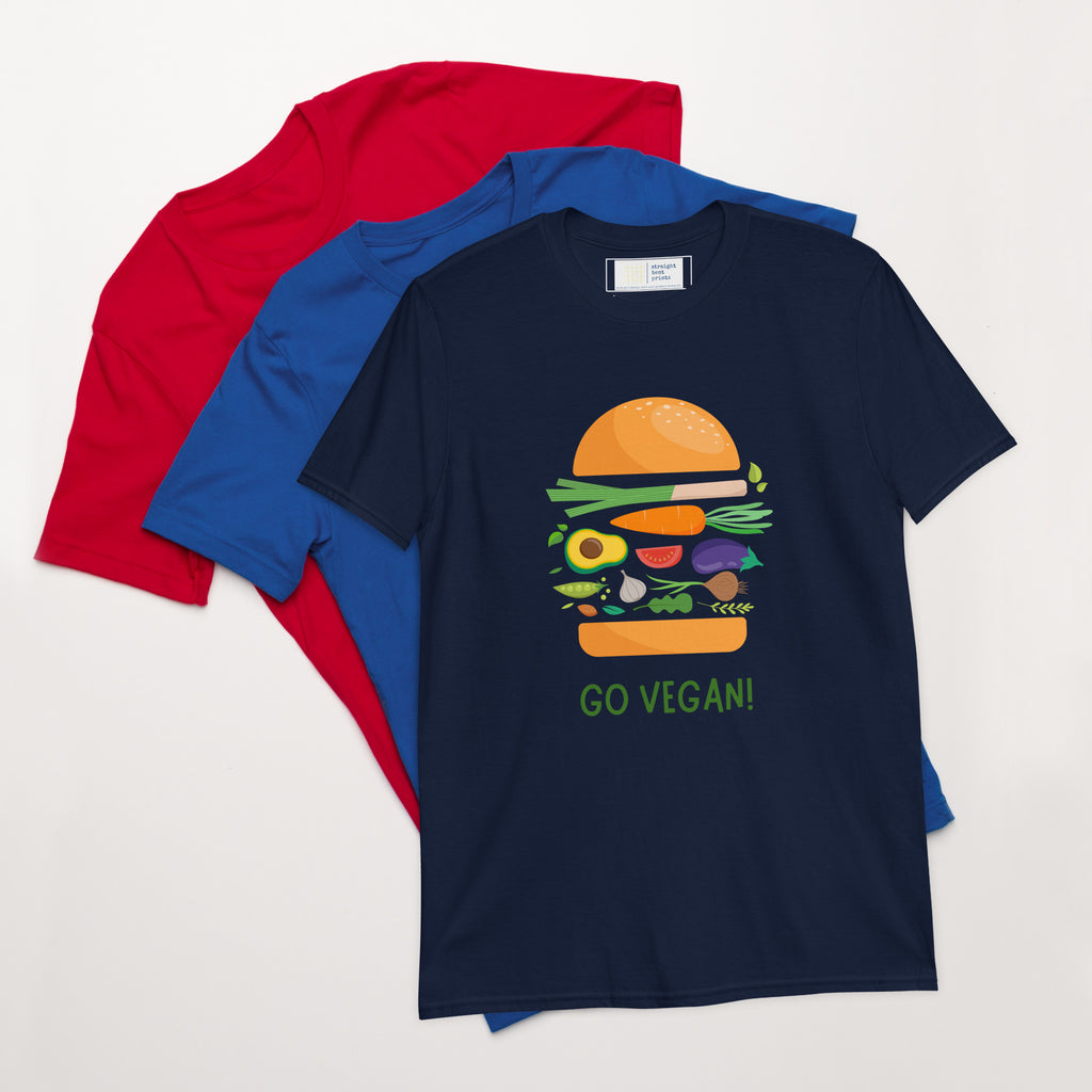 Navy blue t-shirt with a graphic design and text, placed on top of a red and blue t-shirt.