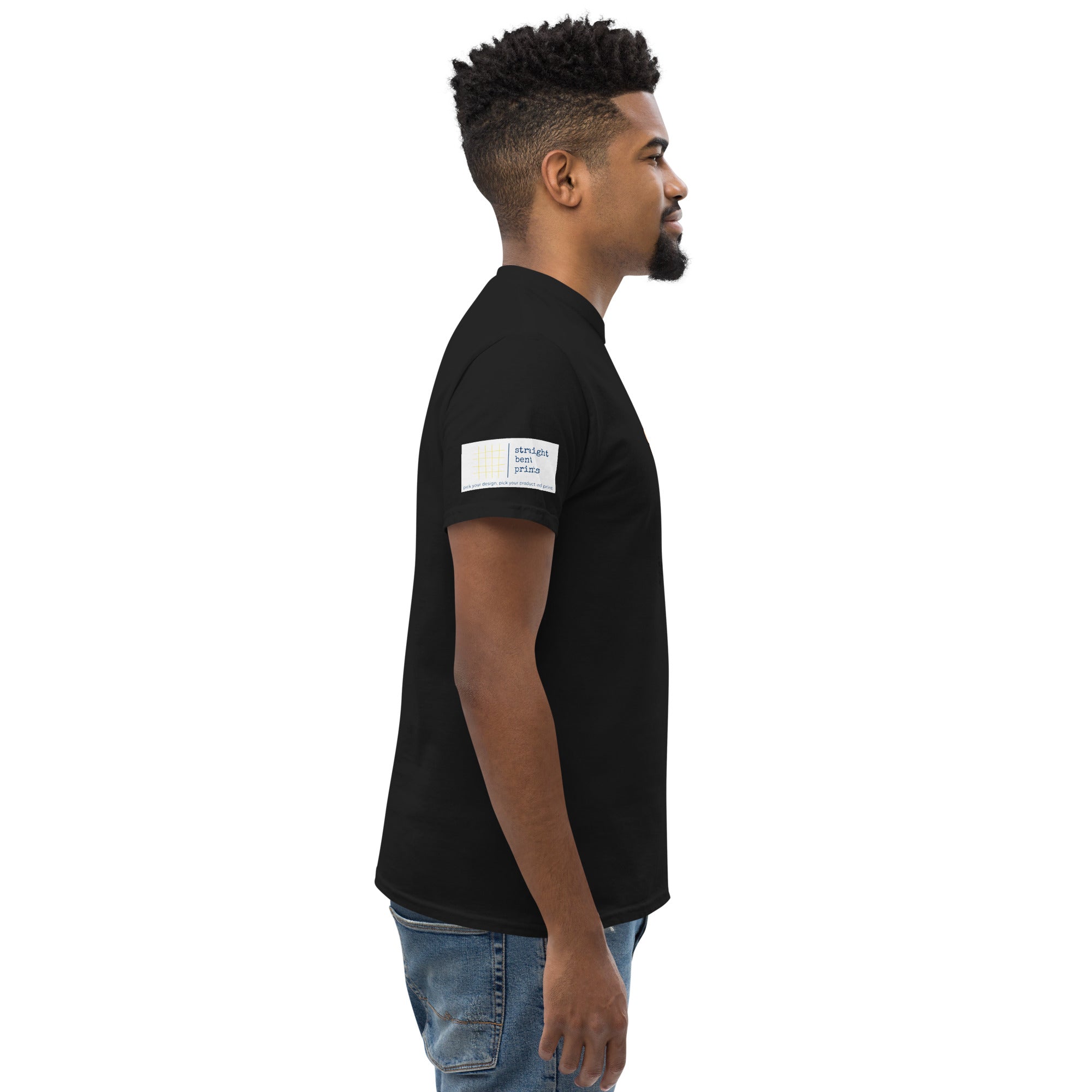 Man wearing a black t-shirt with a white logo on a white background