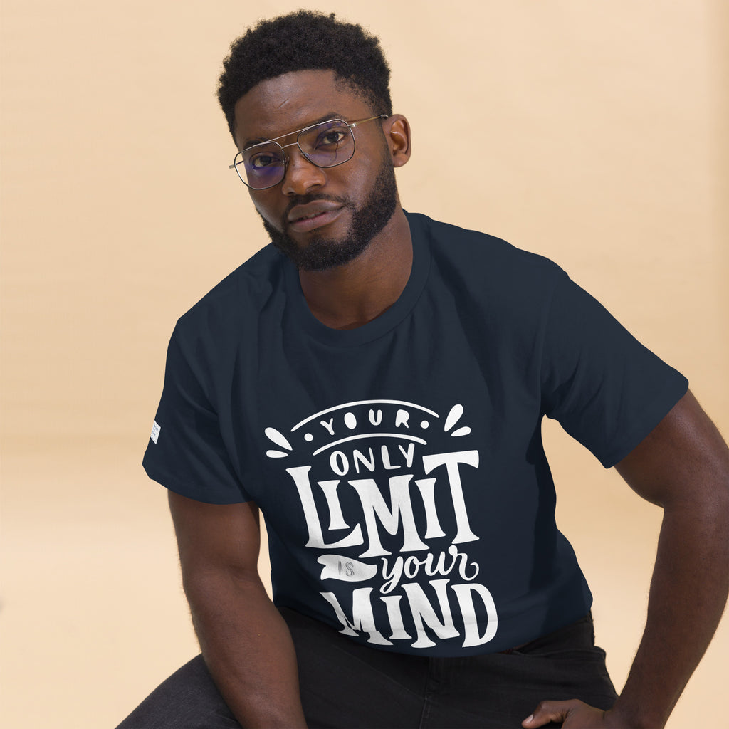 Man wearing a navy blue t-shirt with motivational quote on a beige background