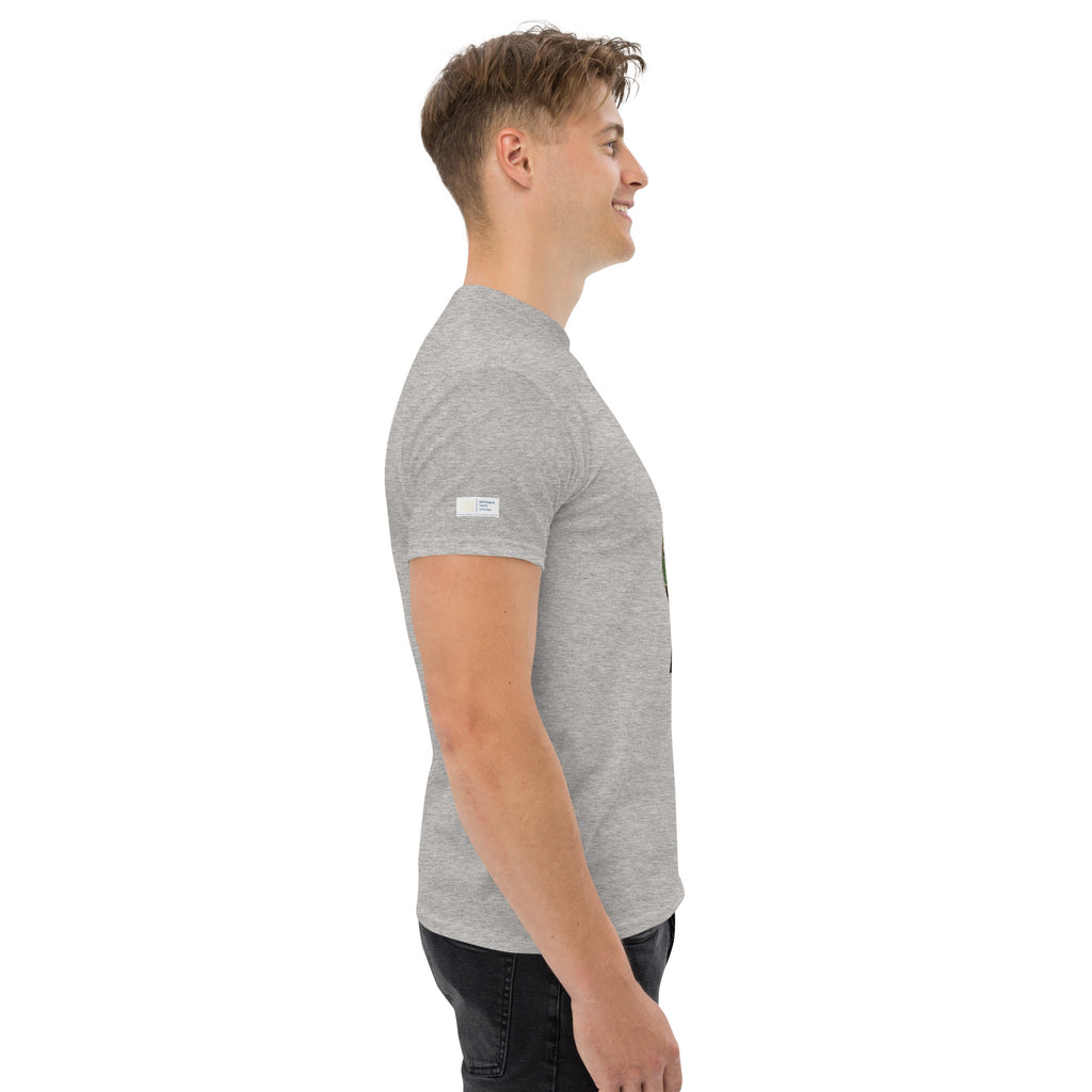 Man wearing a gray t-shirt with a small logo on a white background