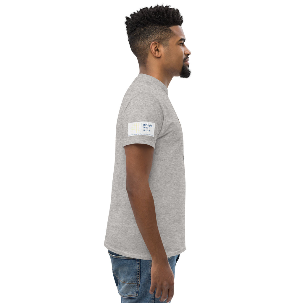 Man wearing a gray t-shirt with a logo on the sleeve against a white background
