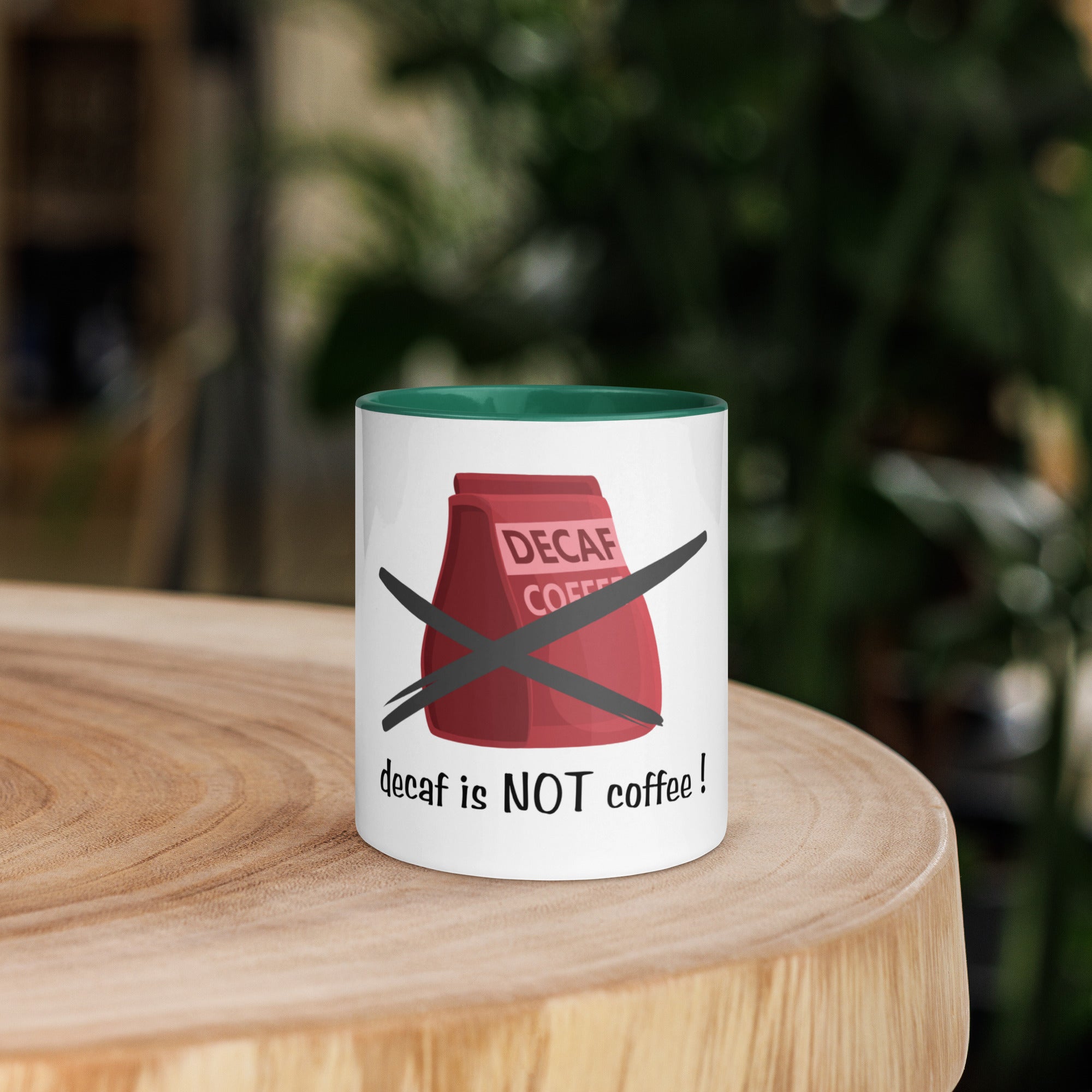 Mug with 'decaf is NOT coffee!' design on a wooden surface