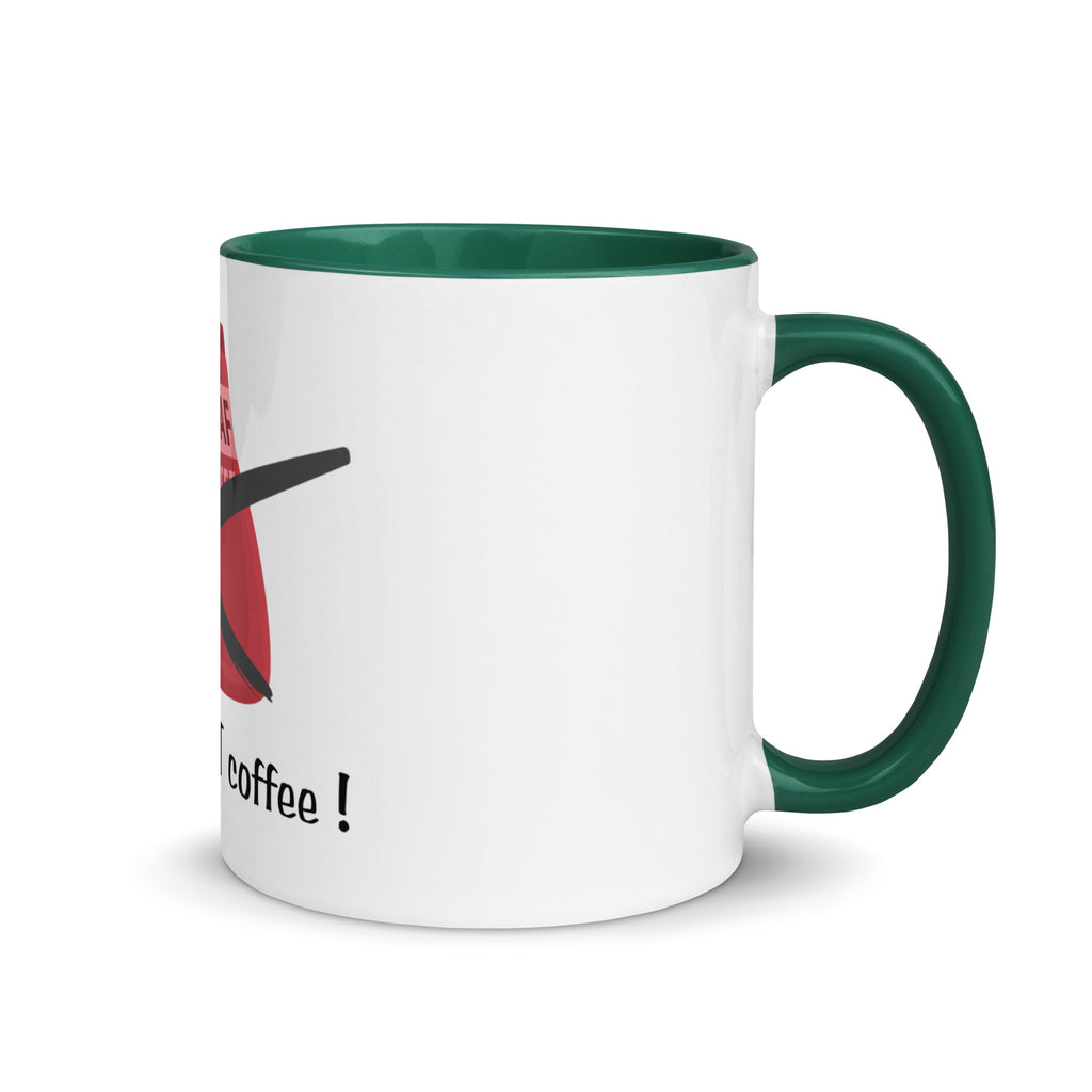 White mug with green handle and interior, featuring a red and black design with text on a white background.
