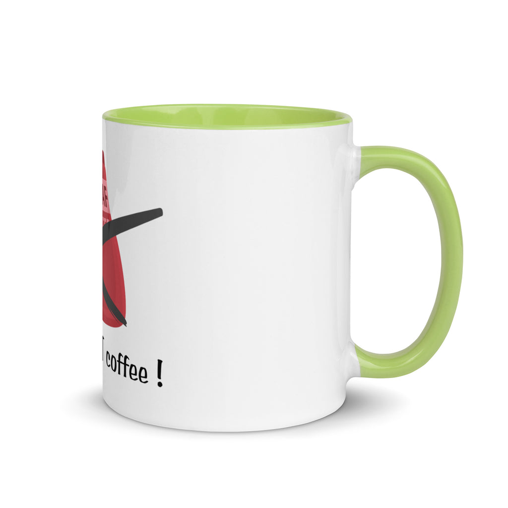 White mug with green handle and interior, featuring a red and black design with text on a white background.