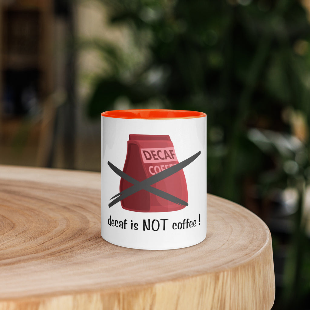 Mug with 'decaf is NOT coffee!' design on a wooden surface