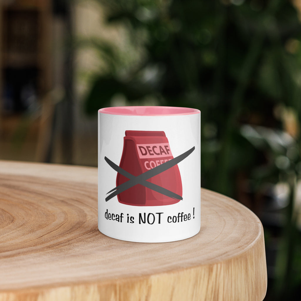 Mug with a red coffee bag graphic and text on a wooden surface