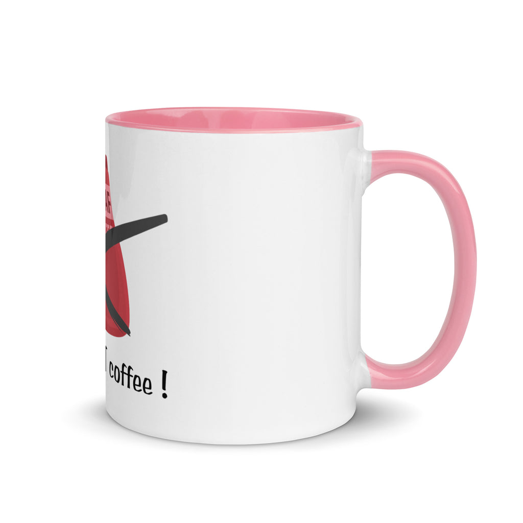 White mug with pink handle and interior, featuring a design and text on a white background