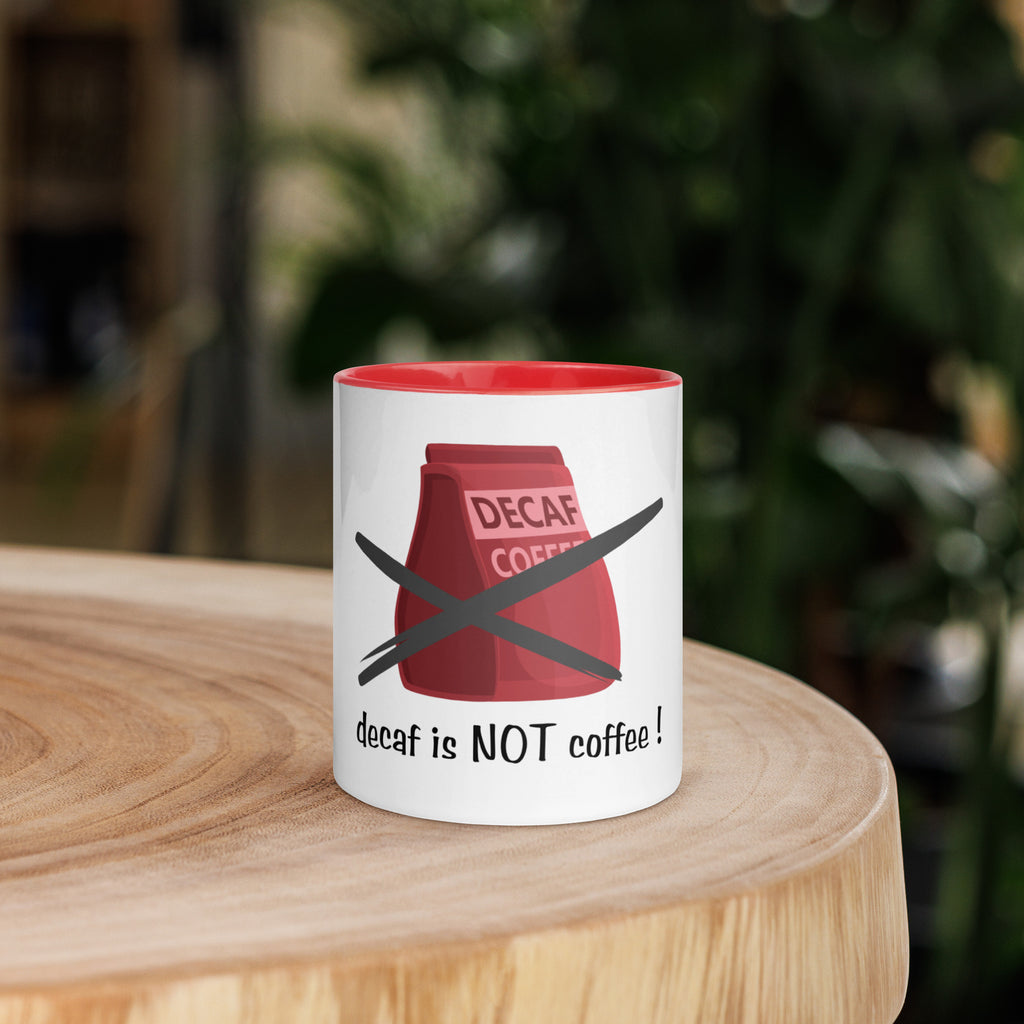 Mug with 'decaf is NOT coffee!' design on a wooden surface