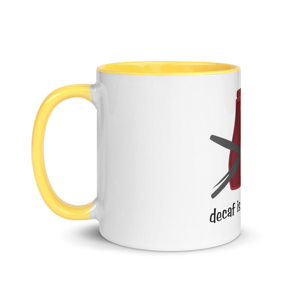 White mug with yellow handle and red and black design on a white background