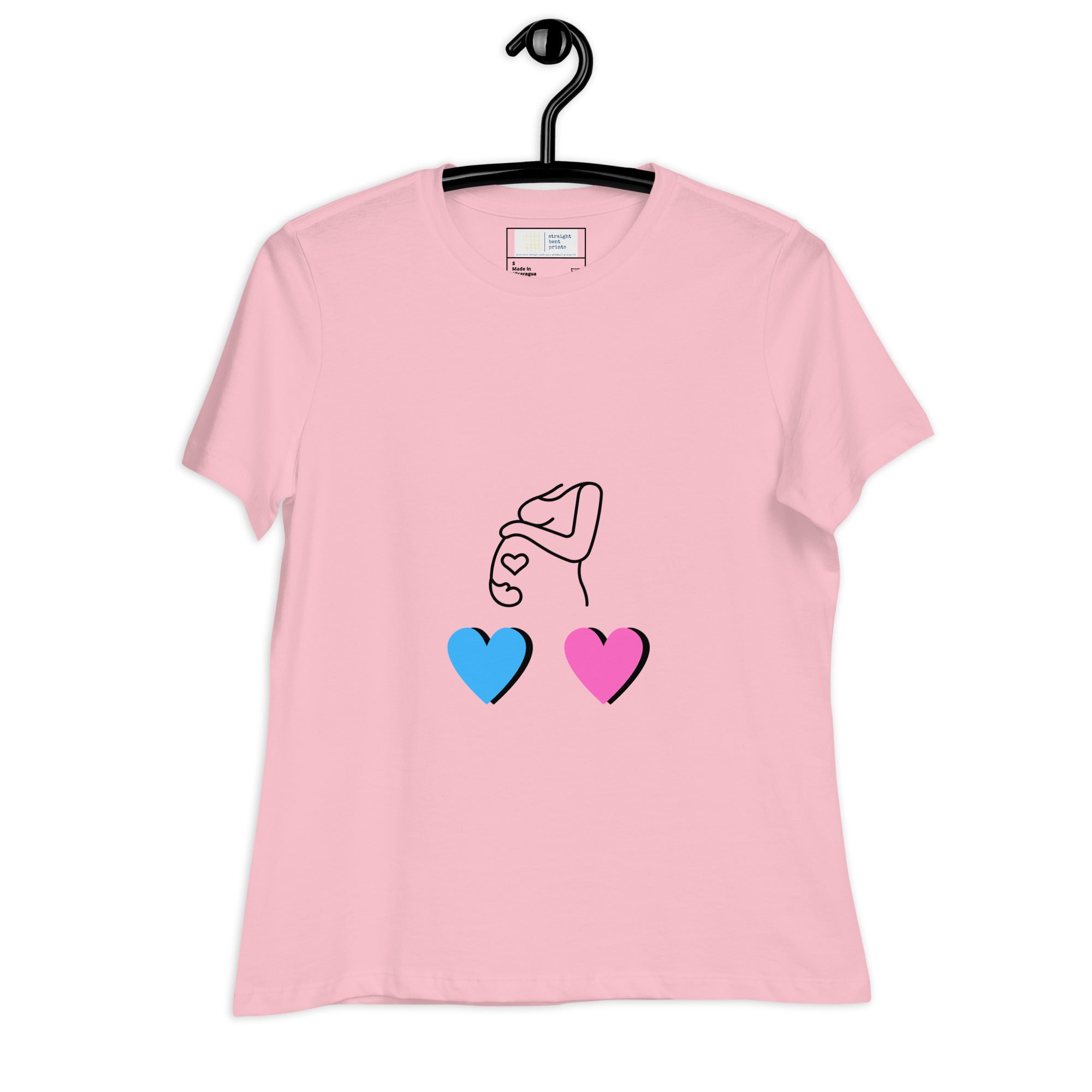 Pink t-shirt with a design of two hearts, one blue and one pink, hanging on a black hanger.